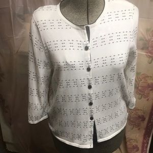 Ladies sweater sized, appears to be more of a large